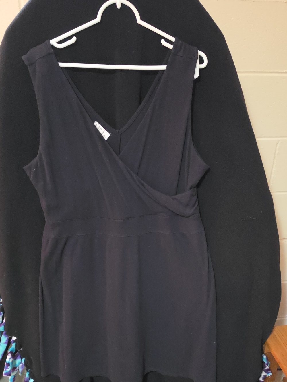 Chic Black Sleeveless Mini Dress with Faux-Wrap Bodice